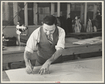 Louis Gushen, chief cutter in the cooperative garment factory at Jersey Homesteads, is cutting the pattern for a woman's coat. Hightstown, New Jersey