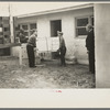 Abe Lipsky, farm foreman (left), has moved into his new home after living in temporary quarters at Jersey Homesteads for more than a year. He is being helped in the moving by Harry Katzenellenbogen, another farmer
