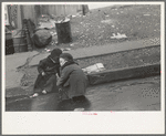 Children playing in the gutter on 139th Street just east of St. Anne's Avenue, Bronx, New York