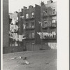 Apartment houses as viewed through vacant lot. In vicinity of 139th Street, just east of St. Anne's Avenue, Bronx, New York City