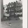 Apartment houses as viewed through vacant lot. In vicinity of 139th Street, just east of St. Anne's Avenue, Bronx, New York City