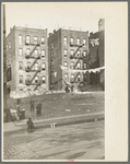 Apartment houses as viewed through vacant lot. In vicinity of 139th Street just east of St. Anne's Avenue Bronx, New York