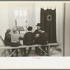 Visiting rabbi teaching the Orthodox religion to children at Jersey Homesteads, New Jersey