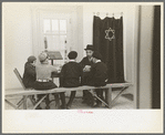 Visiting rabbi teaching the Orthodox religion to children at Jersey Homesteads, New Jersey