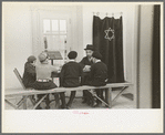Visiting rabbi teaching the Orthodox religion to children at Jersey Homesteads, New Jersey