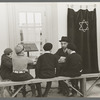 Visiting rabbi teaching the Orthodox religion to children at Jersey Homesteads, New Jersey
