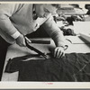 Closeup of cutter's hands (cutting cloth), Jersey Homesteads, Hightstown, New Jersey