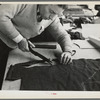 Closeup of cutter's hands (cutting cloth), Jersey Homesteads, Hightstown, New Jersey