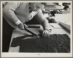 Closeup of cutter's hands (cutting cloth), Jersey Homesteads, Hightstown, New Jersey