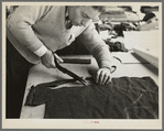 Closeup of cutter's hands (cutting cloth), Jersey Homesteads, Hightstown, New Jersey