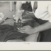 Closeup of presser's hands, Jersey Homesteads factory, Hightstown, New Jersey