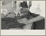 Closeup of presser's hands, Jersey Homesteads factory, Hightstown, New Jersey