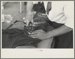 Closeup of presser's hands, Jersey Homesteads factory, Hightstown, New Jersey