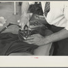 Closeup of presser's hands, Jersey Homesteads factory, Hightstown, New Jersey
