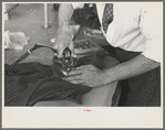 Closeup of presser's hands, Jersey Homesteads factory, Hightstown, New Jersey