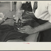 Closeup of presser's hands, Jersey Homesteads factory, Hightstown, New Jersey