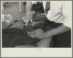 Closeup of presser's hands, Jersey Homesteads factory, Hightstown, New Jersey