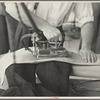 Closeup of presser's hands, Jersey Homesteads factory, Hightstown, New Jersey
