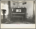 Corner of living room of Rustan brothers' farmhouse near Dickens, Iowa