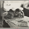 Children reading Sunday papers, Rustan brothers' farm near Dickens, Iowa. Note convenience of running water in background. This farm was formerly owner operated but they are now tenants of Metropolitan Life