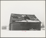 Corn crib on Joe Beving's farm near Dickens, Iowa. Note condition of roof