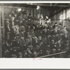 Farmers in gallery of livestock sales hall, Ames, Iowa