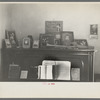 Piano with photograph and mementos in the farmhouse of J E. Herbrandson near Estherville, Iowa
