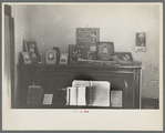 Piano with photograph and mementos in the farmhouse of J E. Herbrandson near Estherville, Iowa
