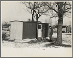 Marcus Miller in front of the shack he built for himself, Spencer, Iowa