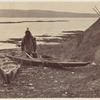 An Esquimaux getting ready for a seal hunt, his Toupek, or skin tent on the right