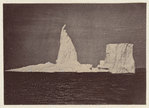 Iceberg with the figure of a man clinging to the top