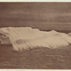 Section of the iceberg, which was broken off from the side, and washed in ridges