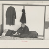 Man examining ankle, homeless men's bureau, Sioux City, Iowa