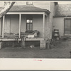 Front porch of house occupied by Mrs. Mary Kelsheiner and sons, Miller Township, Woodbury County, Iowa