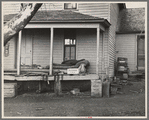 Front porch of house occupied by Mrs. Mary Kelsheiner and sons, Miller Township, Woodbury County, Iowa