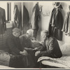 Man reading to fellow inmates, homeless men's bureau, Sioux City, Iowa
