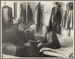 Man reading to fellow inmates, homeless men's bureau, Sioux City, Iowa