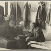 Man reading to fellow inmates, homeless men's bureau, Sioux City, Iowa