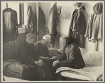 Man reading to fellow inmates, homeless men's bureau, Sioux City, Iowa