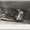 Young flood refugee asleep in schoolhouse, Sikeston, Missouri