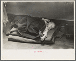 Young flood refugee asleep in schoolhouse, Sikeston, Missouri