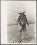 Levee worker during the flood, on a raw day with a thirty-mile wind. These men are very cold and almost exhausted from constant work