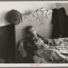 Exhausted flood refugee resting, Sikeston, Missouri