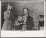 Mother and two children, flood refugees in the schoolhouse at East Prairie, Missouri