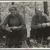 Two lumberjacks waiting for a ride. Near Gheen, Minnesota