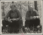 Two lumberjacks waiting for a ride. Near Gheen, Minnesota