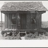 Front porch of sharecropper cabin, New Madrid County, Missouri