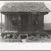 Front porch of sharecropper cabin, New Madrid County, Missouri