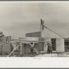 Barn erection. Gable end panels are placed one-half at a time due to weight and length. Southeast Missouri Farms Project