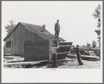 Food storage. Stripping prefabricated forms from wall. Southeast Missouri Farms Project